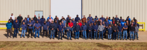 Group photo of the Southwest Electric team in front of the company headquarters, highlighting teamwork and professionalism in the electrical industry.